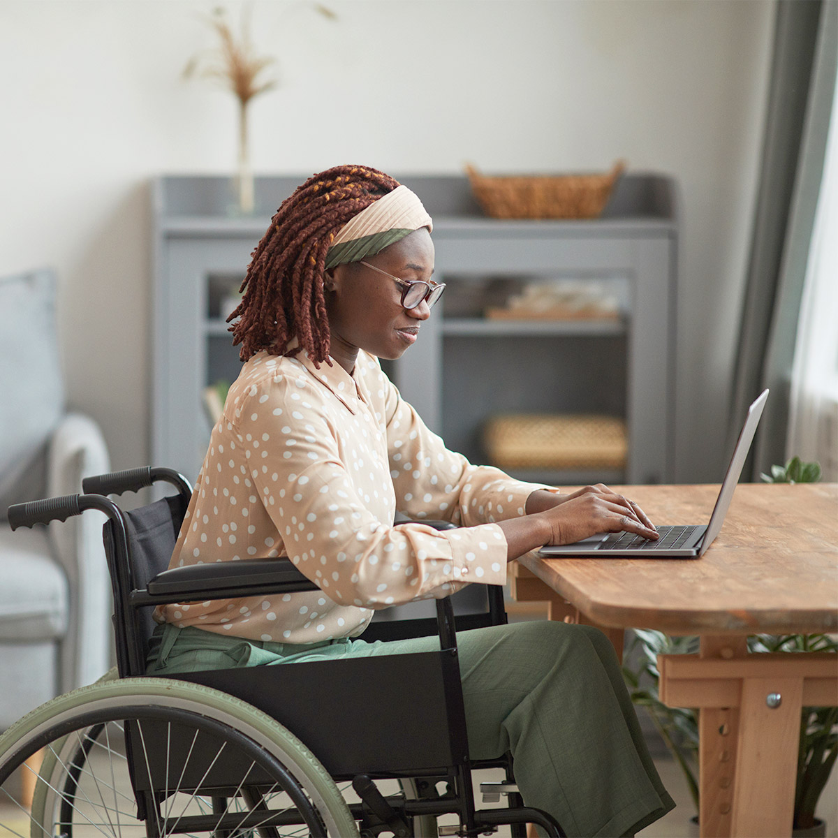 woman on computer researching disability law services